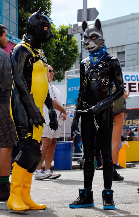 Two latex pups waiting for the cavalcade to begin