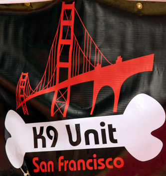 The banner of the SF K9 unit hanging above the play area near Folsom St