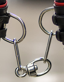Heavy duty livestock grade chain and swivel link connect the leather cuffs of the hobbles