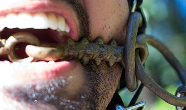 Me wearing my new spiked horse bit. This closeup of the mouthpiece shows the spikes and joint. The two rings on each side make this a Wilson snaffle bit.