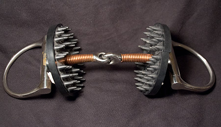 Another view of a racing horse bit with hard rubber bit burrs attached