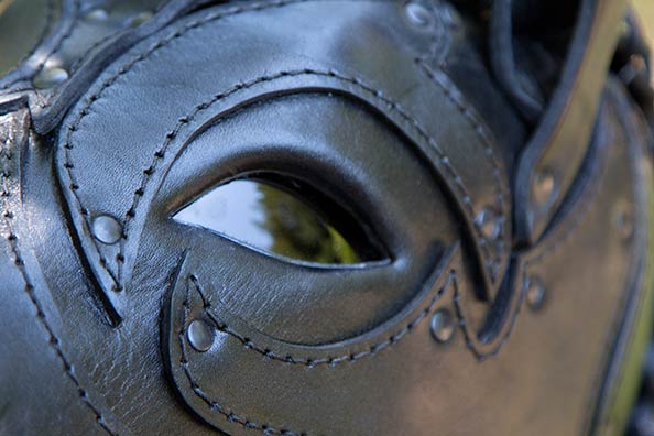 Close of the eye of the Bob Basset mask and the leather application design surrouding it.