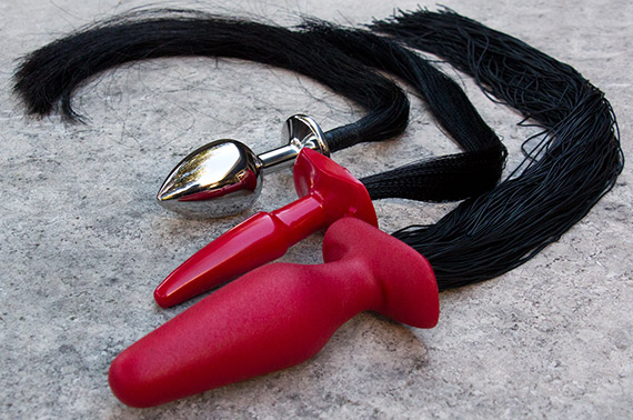 Two PVC pony tail plugs (red plug portion) and one stainless steel plug with real horse hair