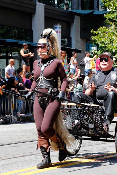 A ponygirl (subMissAnn) pulling a cart during SF Pride 2013